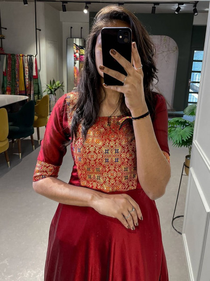 Alluring Maroon Zari Weaved Silk Festive Wear Gown